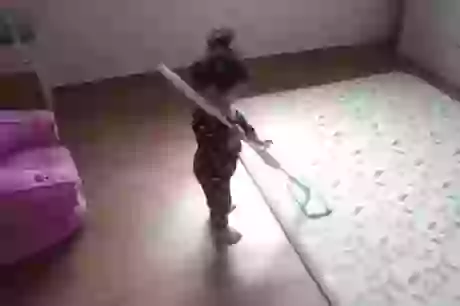 Cute Little girl likes mopping a bit too much