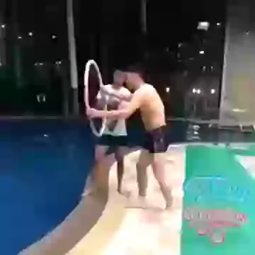 Funny boy in swimming pool