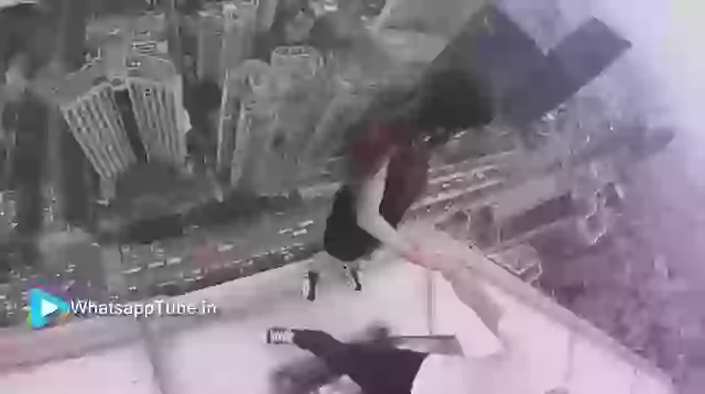 Girl Stunt On Building Edge