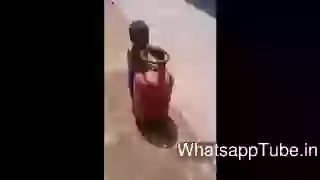 Small baby try to carry cylinder